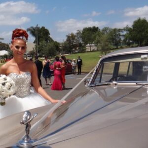 happy bride with gold vintage wedding car sydney